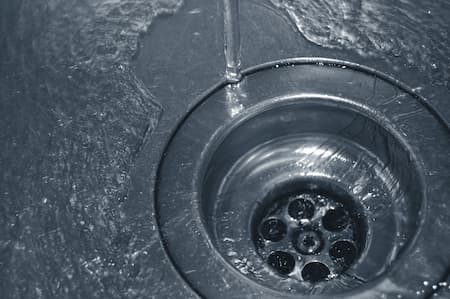 How to Fix Common Drain Clogs and When to Call a Plumber